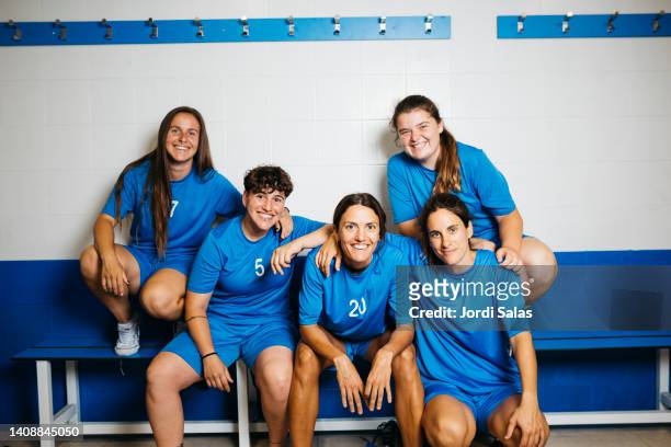 female soccer team in the locker room - friendly match stock pictures, royalty-free photos & images