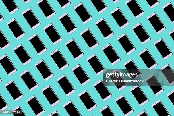 white mobile phones pattern on turquoise blue background. concept of smar tphone, mobile phone, sms, messaging, entertainment, calls, conversation, internet, connection - mobile app isometric stock pictures, royalty-free photos & images