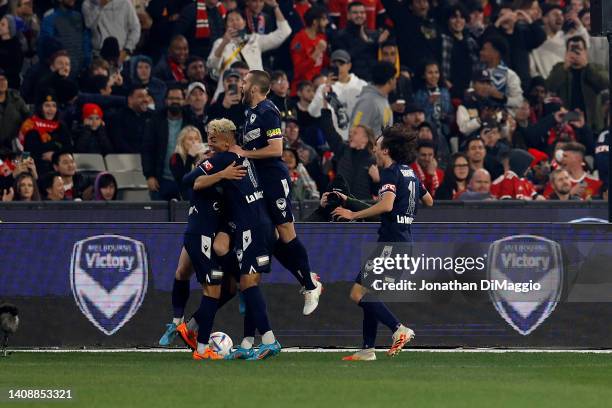 Victory players celebrate a goal during the Pre-Season friendly match between Melbourne Victory and Manchester United at Melbourne Cricket Ground on...