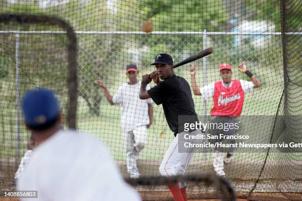 Dominican Republic Air Force baseball players take practice at the base facilities that are used by the San Francisco Giants Academy in Santo...