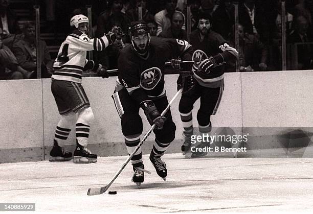 Ken Morrow of the New York Islanders skates with the puck during Game 3 of the 1982 Division Finals against the New York Rangers on April 18, 1982 at...