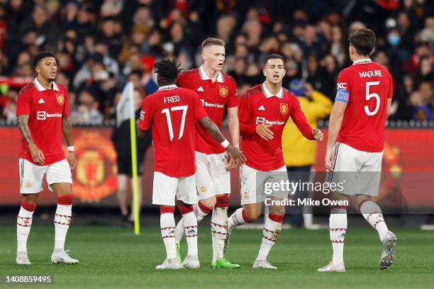 Scott McTominay of Manchester United celebrates with teammates after scoring a goal during the Pre-Season friendly match between Melbourne Victory...