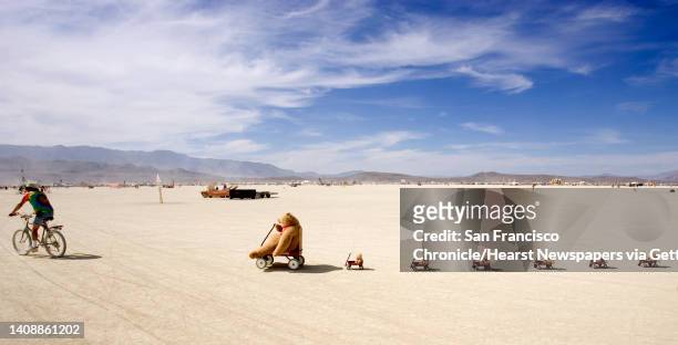 Fred Dickson of Petaluma, Ca., rides across the playa with his teddy bear train on Sunday, September 3, 2006. Coverage of the 2006 Burning Man...