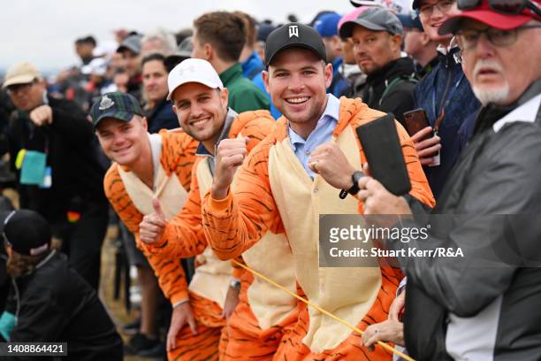 Fans of Tiger Woods of the United States are photographed in tiger onesies during Day Two of The 150th Open at St Andrews Old Course on July 15, 2022...