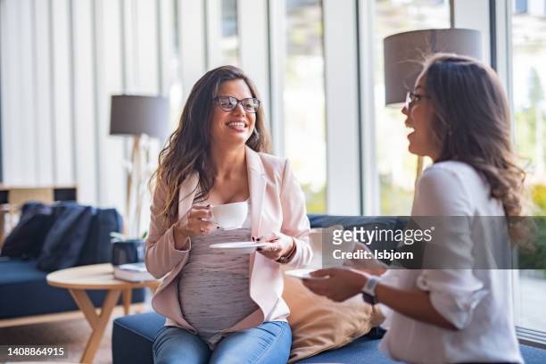 pregnant woman and her female friend drinking coffee in cafe - pregnant coffee 個照片及圖片檔