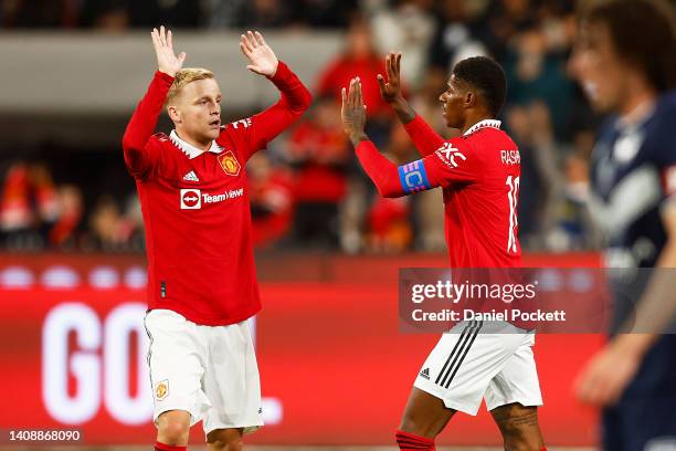 Marcus Rashford of Manchester United celebrates with Donny van de Beek of Manchester United kicking a goal during the Pre-Season friendly match...