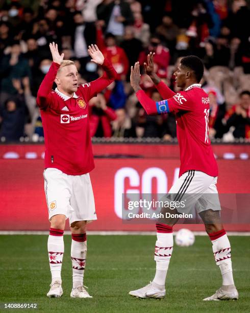 Marcus Rashford of Manchester United celebrates scoring their third goal during the pre-season friendly match between Melbourne Victory and...