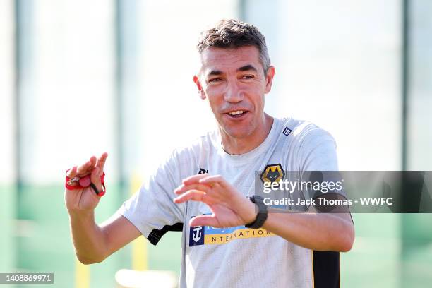 Bruno Lage, Manager of Wolverhampton Wanderers speaks to his players during a Wolverhampton Wanderers Pre-Season Training Session on July 13, 2022 in...