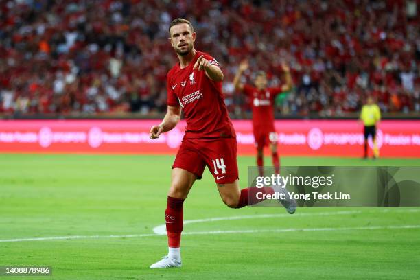 Jordan Henderson of Liverpool celebrates after scoring his team's first goal against Crystal Palace during the first half of their preseason friendly...