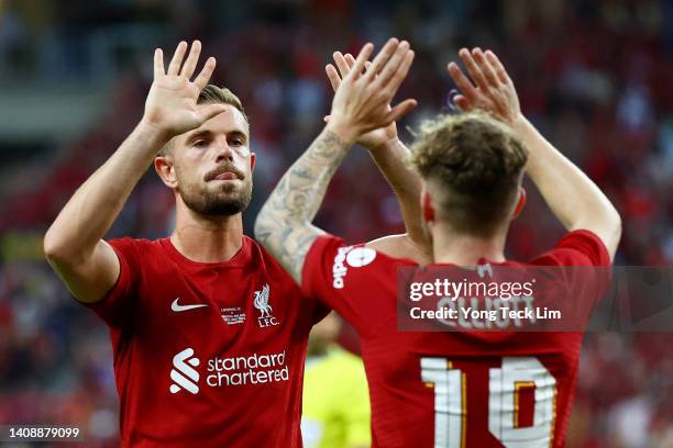 Jordan Henderson of Liverpool celebrates with Harvey Elliott after scoring their first goal against Crystal Palace during the first half of their...