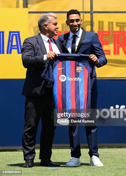 Barcelona president Joan Laporta and Raphael Dias Belloli 'Raphinha' pose for the media as he is presented as a FC Barcelona player at Ciutat...