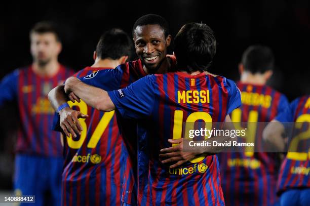 Seydou Keita of FC Barcelona congratulates Lionel Messi of FC Barcelona after Lionel Messi scored his team's seventh goal during the UEFA Champions...