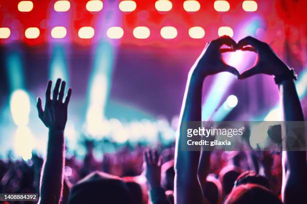 rave party silhouettes. - crowd hand heart stock pictures, royalty-free photos & images