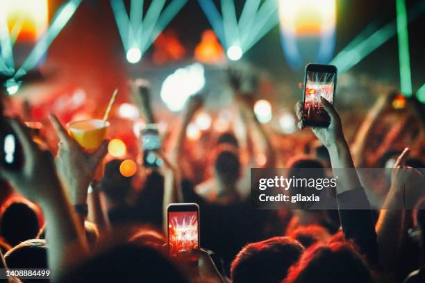 rave party silhouettes. - calling festival stock pictures, royalty-free photos & images