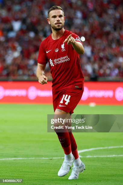 Jordan Henderson of Liverpool celebrates after scoring his team's first goal against Crystal Palace during the first half of their preseason friendly...