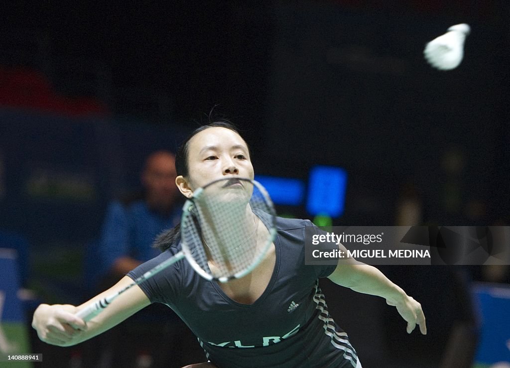 Pi Hongyan Pi Hongyan of France returns the shuttlecock to Carolina Marin of ...