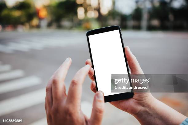 woman using smartphone - buildings screens stock pictures, royalty-free photos & images