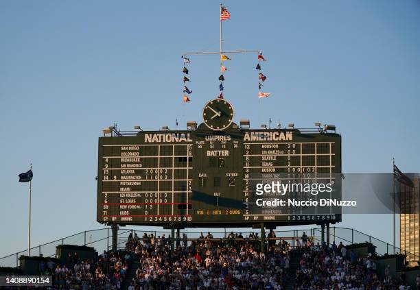 General view of the old scoreboard bathed in sun light during a game between the Chicago Cubs and the New York Mets at Wrigley Field on July 14, 2022...