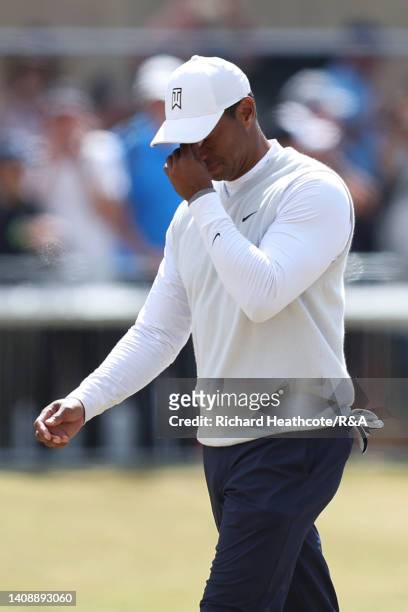 Tiger Woods of the United States reacts whilst walking on the 18th hole during Day Two of The 150th Open at St Andrews Old Course on July 15, 2022 in...