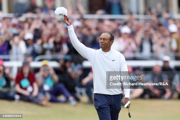 Tiger Woods of the United States acknowledges the crowd on the 18th hole during Day Two of The 150th Open at St Andrews Old Course on July 15, 2022...
