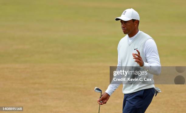 Tiger Woods of the United States acknowledges the crowd on the 18th green during Day Two of The 150th Open at St Andrews Old Course on July 15, 2022...