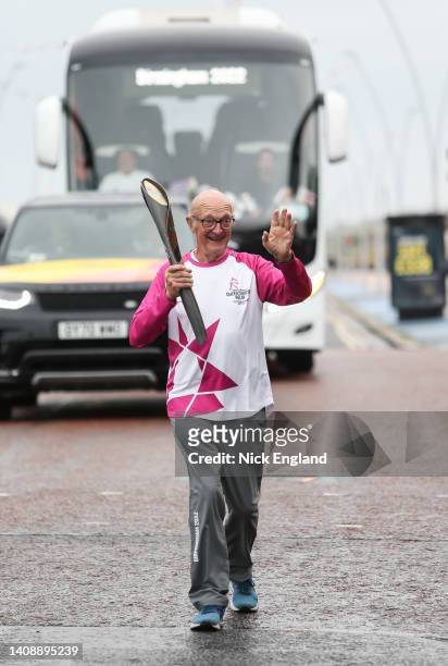 Batonbearer Tony Lummis holds the Queen's Baton during the Birmingham 2022 Queen's Baton Relay on July 15, 2022 at South Shields, United Kingdom.