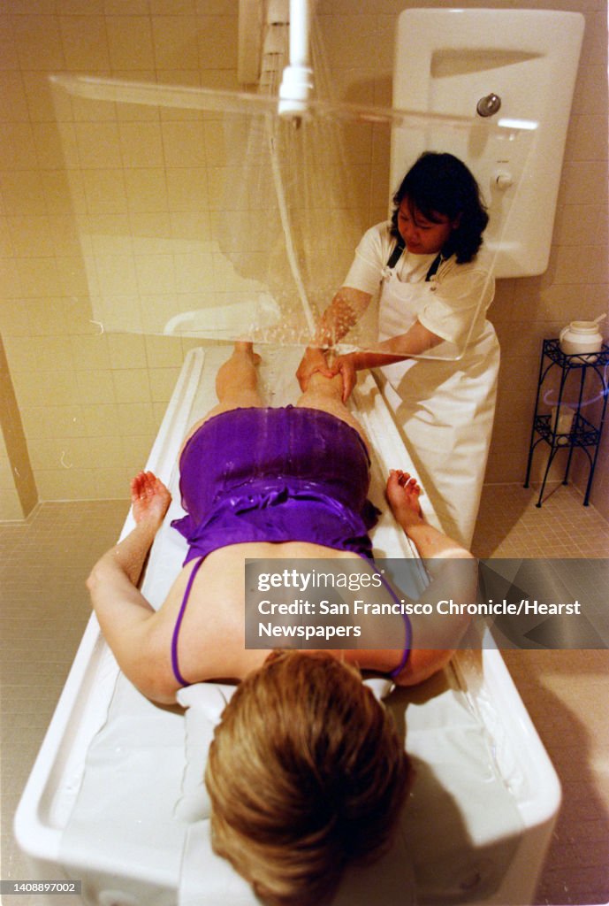 SPA 02/C/23JAN98/PF/CG --- Deborah Olson recieves a Vichy Spa, a Hydrotherapy Shower with Swedish massage, from certified massage therapist Marietta Rubianes at the Sandra Caron European Spa in San Mateo. (CHRONICLE PHOTO BY CARLOS AVILA GONZALEZ)