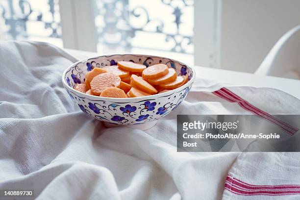 bowl of carrot slices - dish towel bildbanksfoton och bilder