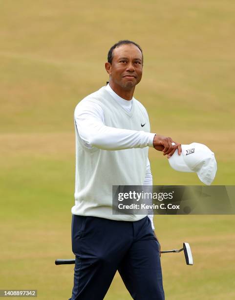 Tiger Woods of the United States acknowledges the crowd on the 18th green during Day Two of The 150th Open at St Andrews Old Course on July 15, 2022...