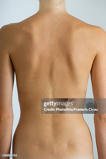 woman's naked back, mid section - anatomy of lower back stock pictures, royalty-free photos & images