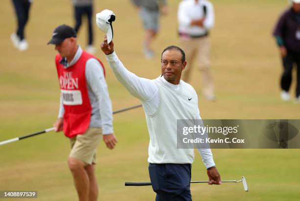 Tiger Woods of the United States acknowledges the crowd on the 18th green during Day Two of The 150th Open at St Andrews Old Course on July 15, 2022...