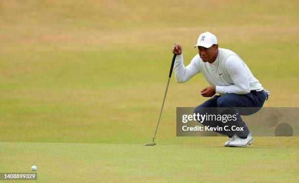 Tiger Woods of The United States lines up a putt on the 18th green during Day Two of The 150th Open at St Andrews Old Course on July 15, 2022 in St...