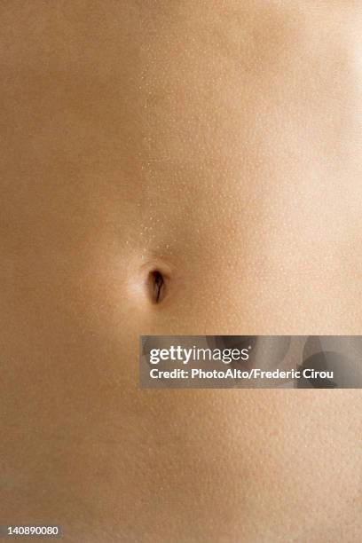 woman's navel, close-up - bauchnabel stock-fotos und bilder