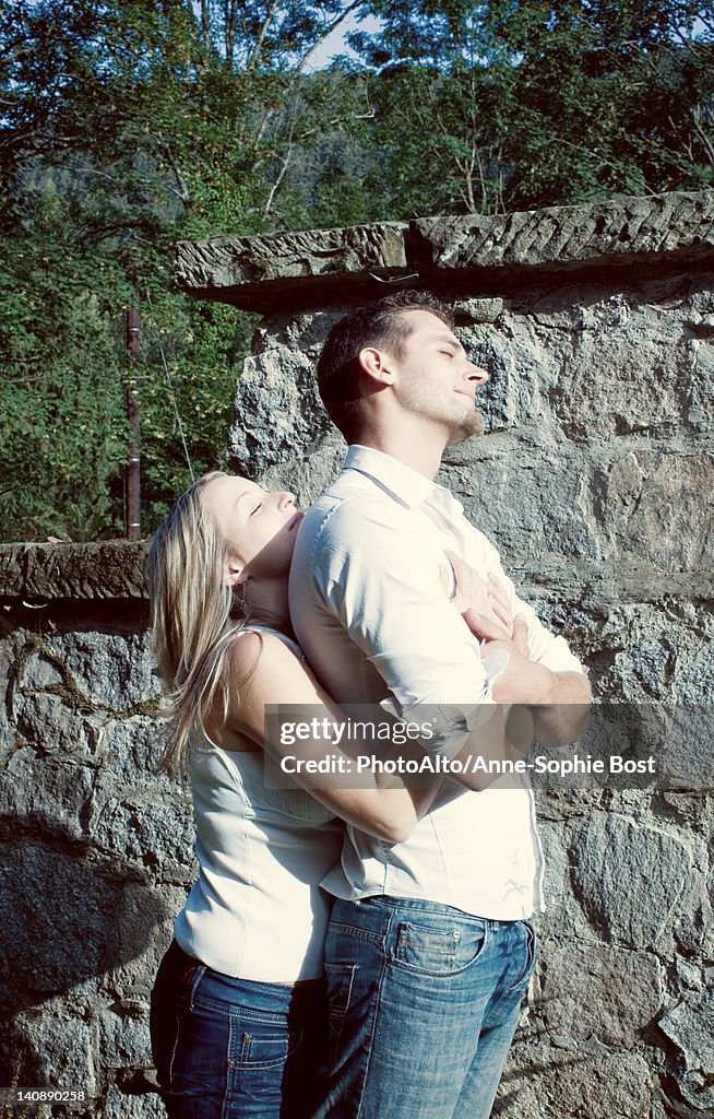 Couple embracing outdoors