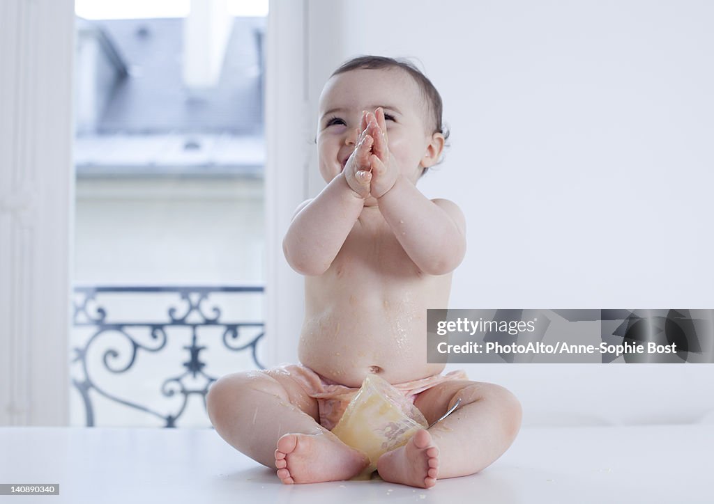 Infant covered in food