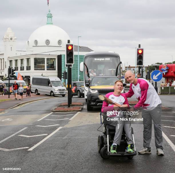 Batonbearers Stephen Miller and Paul Harris hold the Queen's Baton during the Birmingham 2022 Queen's Baton Relay on July 15, 2022 at Whitley Bay,...