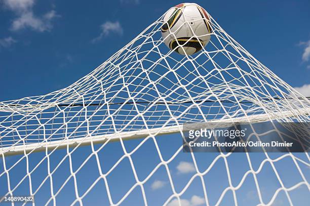 soccer ball hitting net - soccer goal stock pictures, royalty-free photos & images