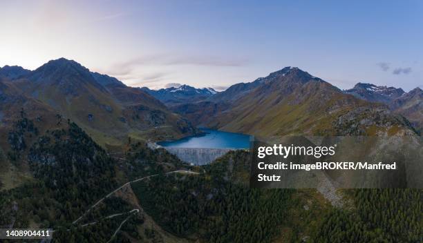 aerial view of lac de cleuson with its dam in the canton of valais, switzerland - reservoir stock-fotos und bilder