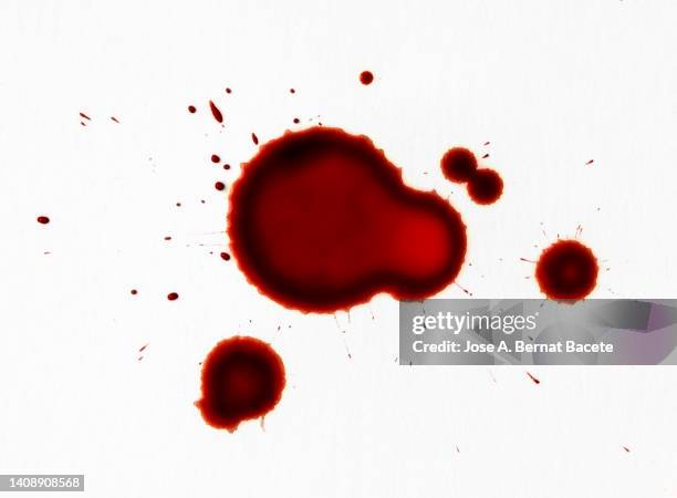 drops of blood on slides on a white surface. - blood splatter foto e immagini stock