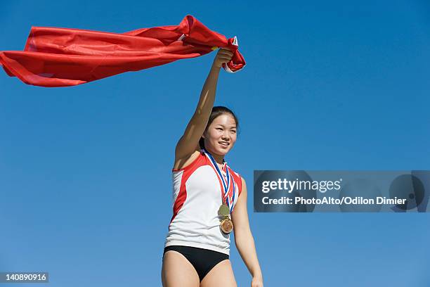 female athlete being honored on podium - olympic podium stock pictures, royalty-free photos & images