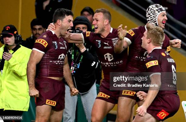 Ben Hunt of Queensland celebrates with his team mates after scoring the match winning try after game three of the State of Origin Series between the...
