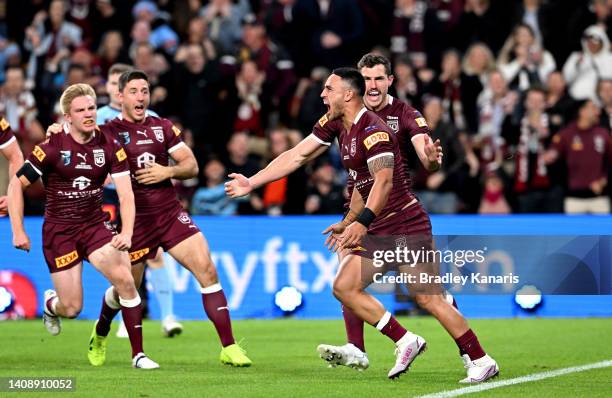 Valentine Holmes of Queensland celebrates after scoring a try during game three of the State of Origin Series between the Queensland Maroons and the...