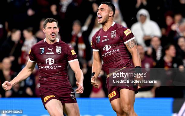 Valentine Holmes of Queensland celebrates after scoring a try during game three of the State of Origin Series between the Queensland Maroons and the...
