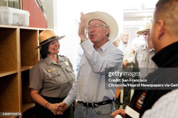 Secretary of the Interior Ken Salazar jokes with Public Affairs Specialist, Alexandra Picavet as he receives a tour of the Crissy Field Center....