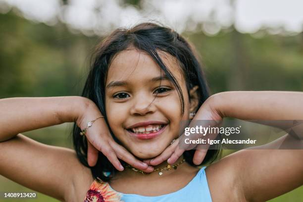 smiling latin girl posing - black hair stock pictures, royalty-free photos & images