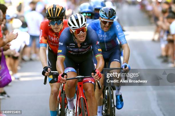 Fred Wright of United Kingdom and Team Bahrain Victorious, Mads Pedersen of Denmark and Team Trek - Segafredo and Hugo Houle of Canada and Team...