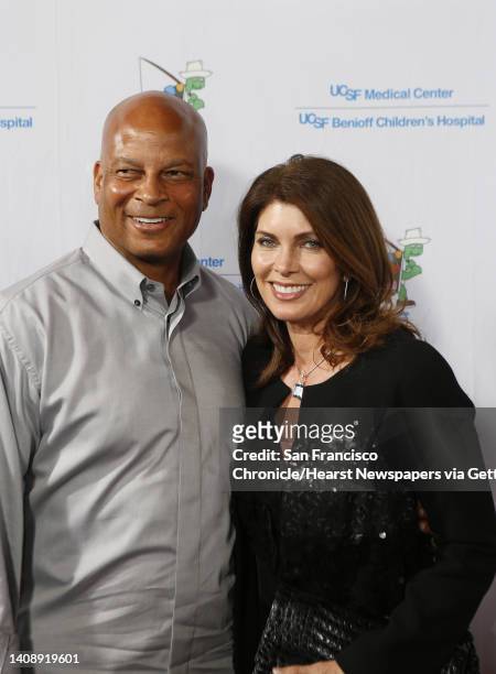 Ronnie Lott and his wife, Karen Lott pose for the photographers as celebrities arrived for the Painted Turtle and UCSF Medical Center benefit, "A...