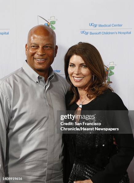 Ronnie Lott and his wife, Karen Lott pose for the photographers as ...