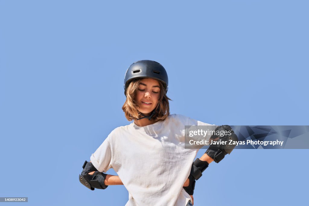 Young Girl Ready To Ride A BMX Bike Or Skateboard
