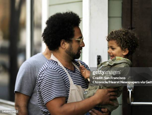 Chef Ravi Kapur plays with his son, Makoa Kapur as he holds a restaurant pop up called Paniolo Social Club at Bloodhound Bar in San Francisco, Calif,...